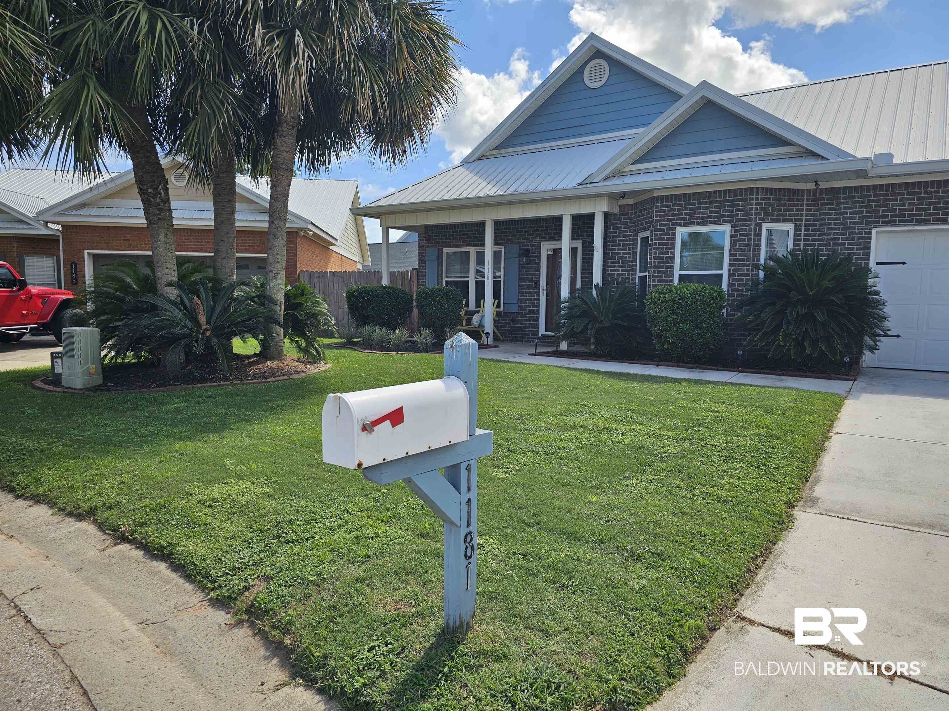 1181 Sloane Cove Foley, AL 36535 - Photo 2 of 10 Brick and siding exterior with a metal roof