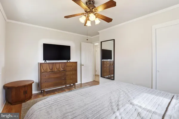 a living room with furniture window and wooden floor
