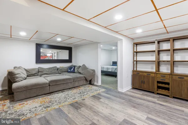 a bedroom with a bed and a mirror