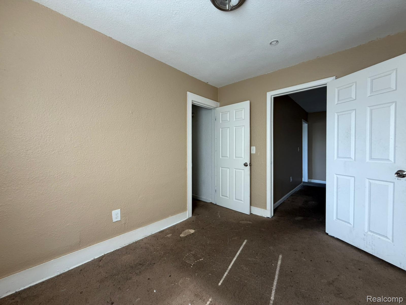 15935 Normandy Street Detroit, MI 48238 - Photo 21 of 28 Neutral-toned walls and white trim complement the existing flooring