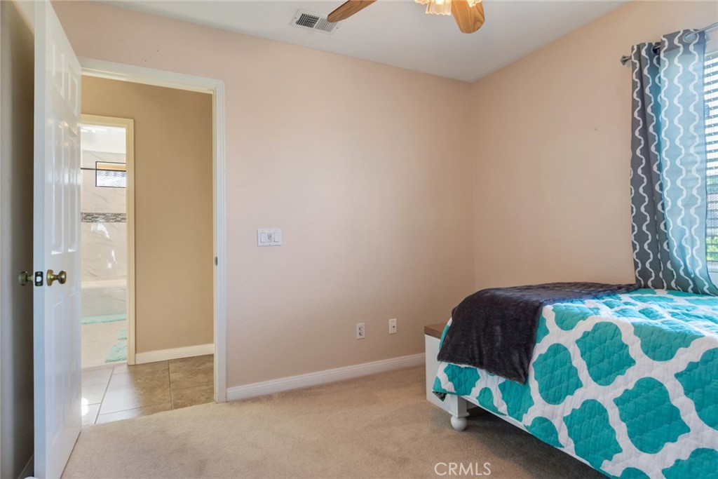 20885 Bakal Drive Riverside, CA 92508 - Photo 28 of 47 a bedroom with a bed and a window