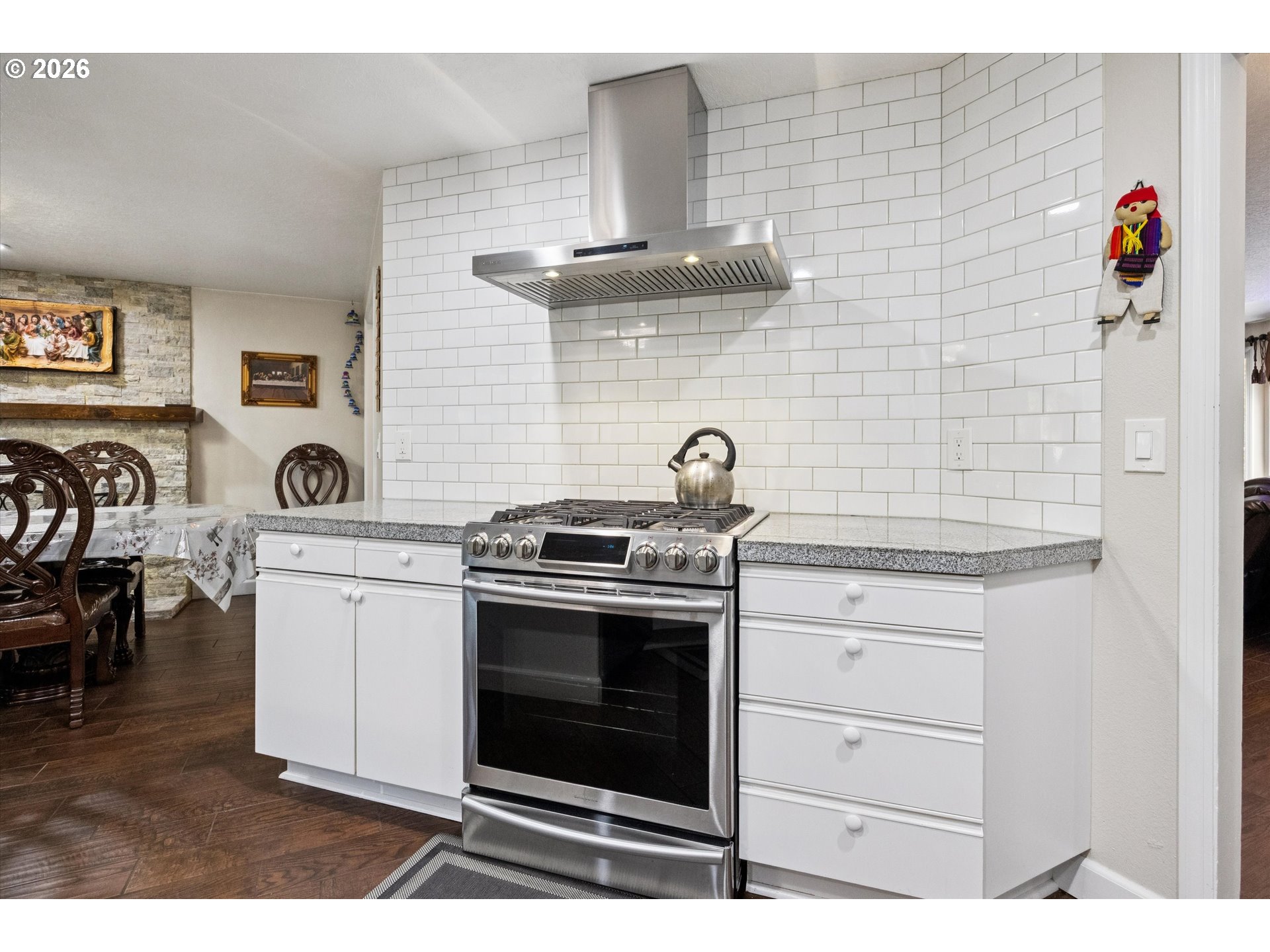 345 Southwest 207th Avenue Beaverton, OR 97006 - Photo 13 of 28 a kitchen with a stove and a sink