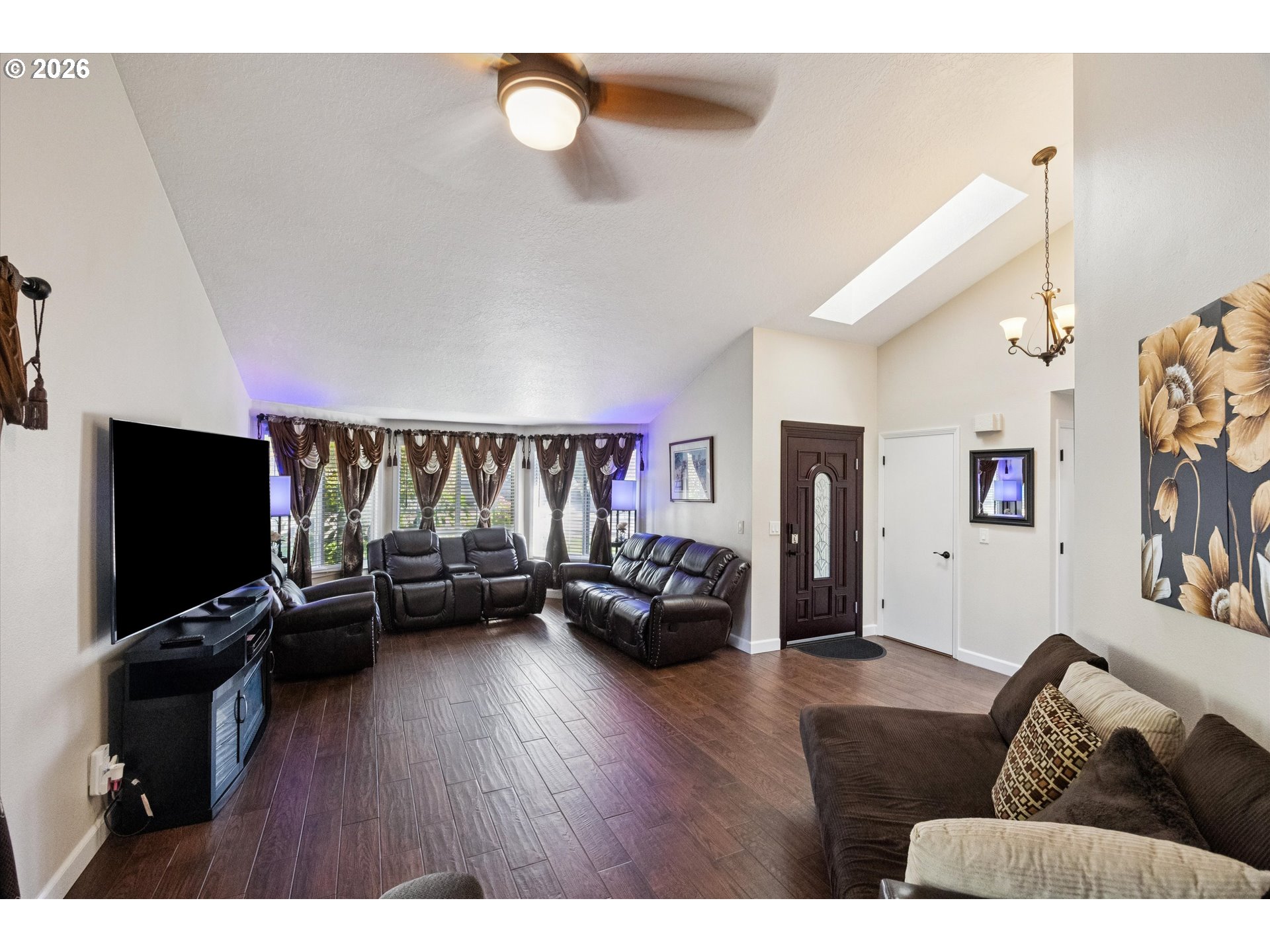 345 Southwest 207th Avenue Beaverton, OR 97006 - Photo 4 of 28 a living room with furniture and a flat screen tv