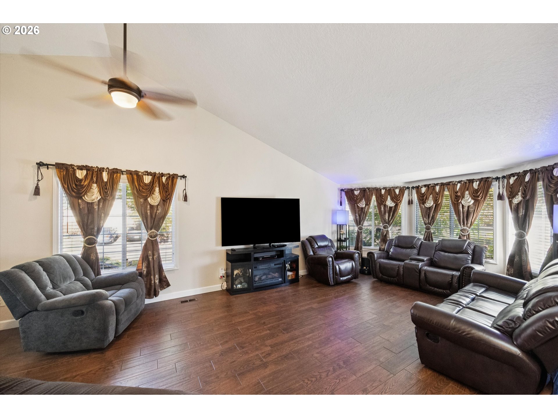 345 Southwest 207th Avenue Beaverton, OR 97006 - Photo 5 of 28 a living room with furniture and a flat screen tv