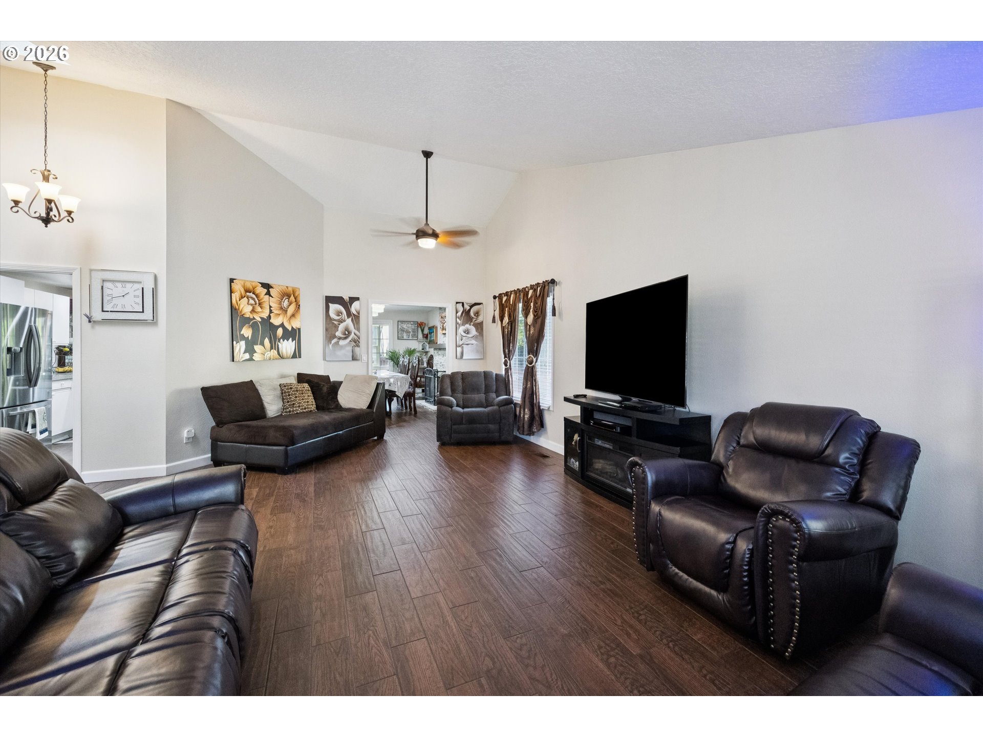 345 Southwest 207th Avenue Beaverton, OR 97006 - Photo 6 of 28 a living room with furniture and a flat screen tv