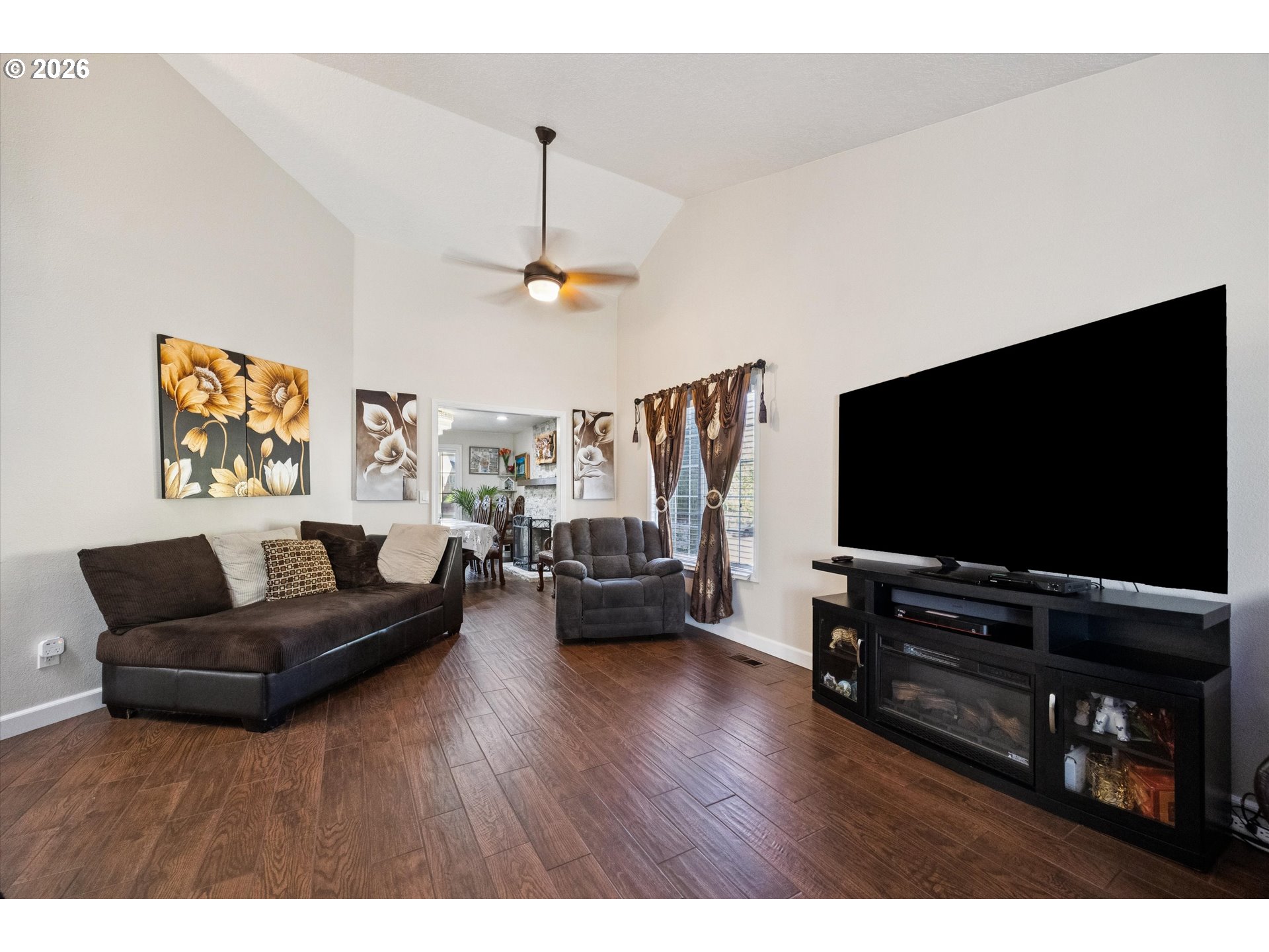345 Southwest 207th Avenue Beaverton, OR 97006 - Photo 8 of 28 a living room with furniture and a flat screen tv