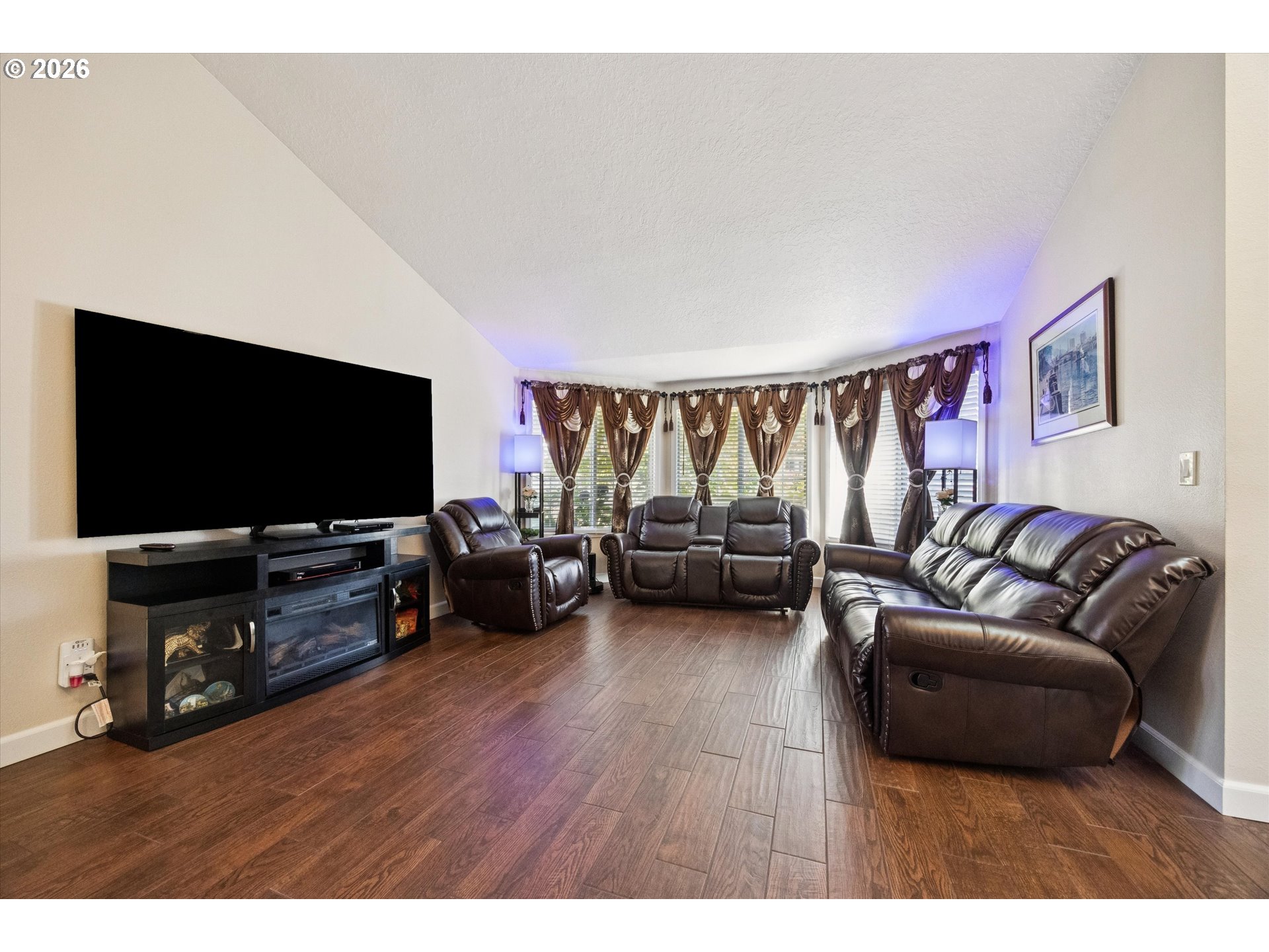 345 Southwest 207th Avenue Beaverton, OR 97006 - Photo 9 of 28 a living room with furniture and a flat screen tv