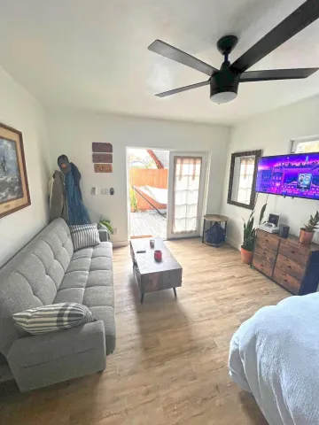 a living room with furniture and a large window