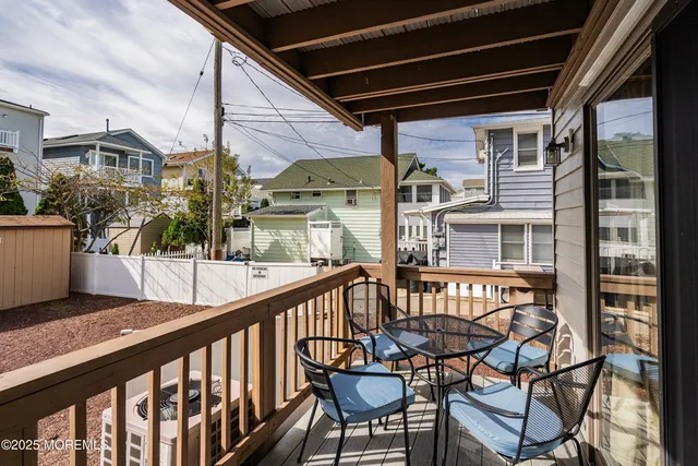 a bathroom with a granite countertop toilet and a sink