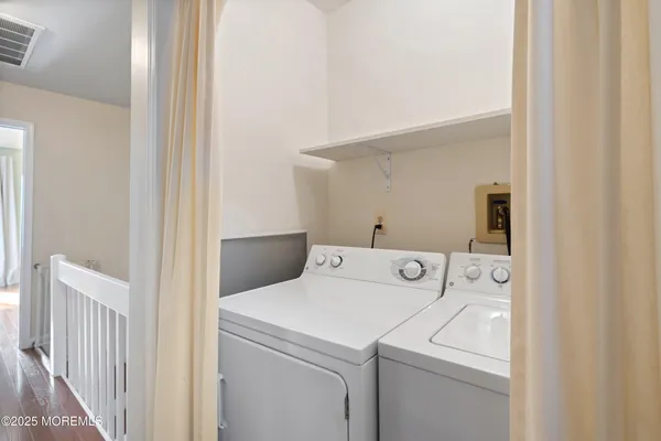 a view of a chair and table in the balcony