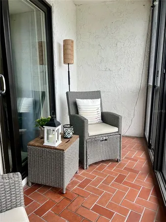 a living room with a couch and a stove top oven