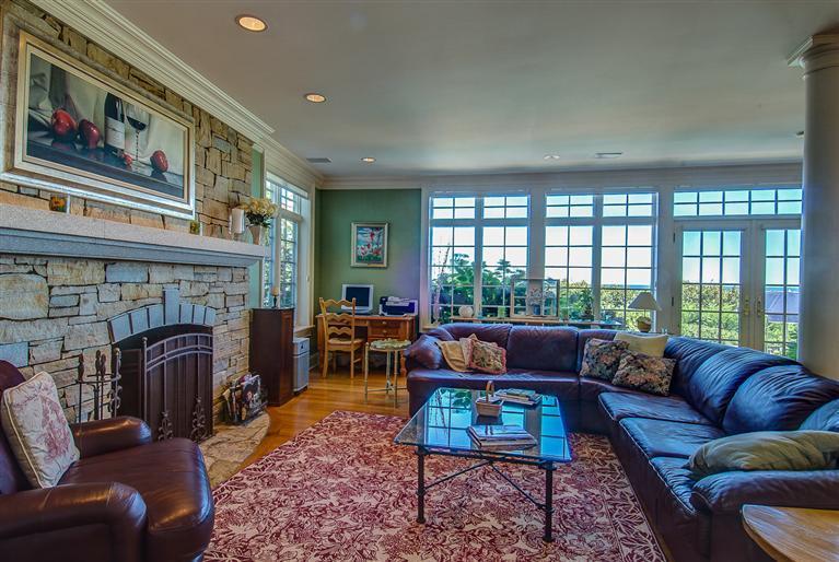 30 Williams Path West Barnstable, MA 02668 - Photo 19 of 35 a living room with furniture a fireplace and a floor to ceiling window