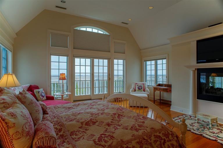 30 Williams Path West Barnstable, MA 02668 - Photo 22 of 35 a bedroom with a bed and glass windows