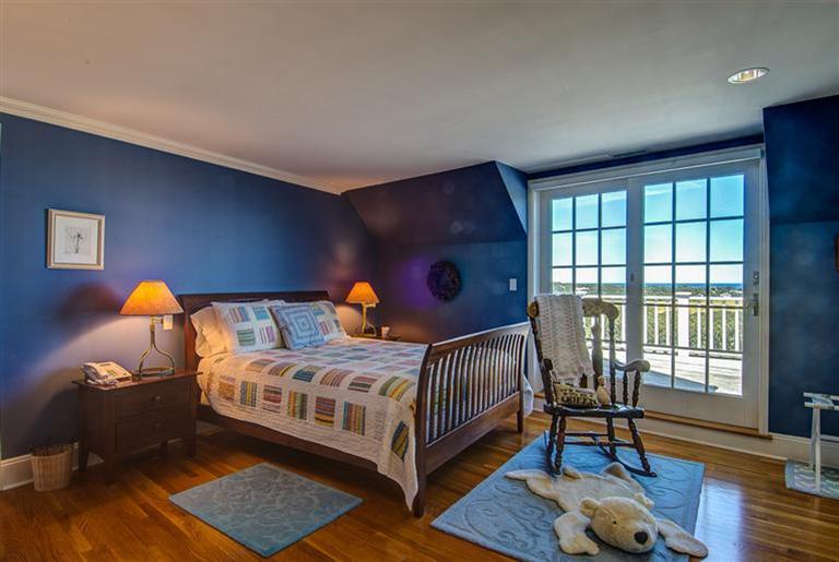 30 Williams Path West Barnstable, MA 02668 - Photo 24 of 35 a bedroom with a bed and wooden floor