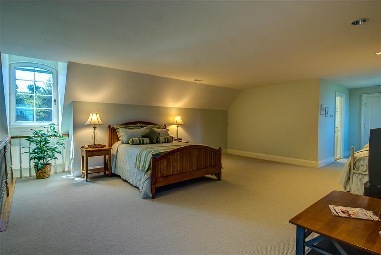 30 Williams Path West Barnstable, MA 02668 - Photo 29 of 35 a bedroom with a bed lamp and a desk