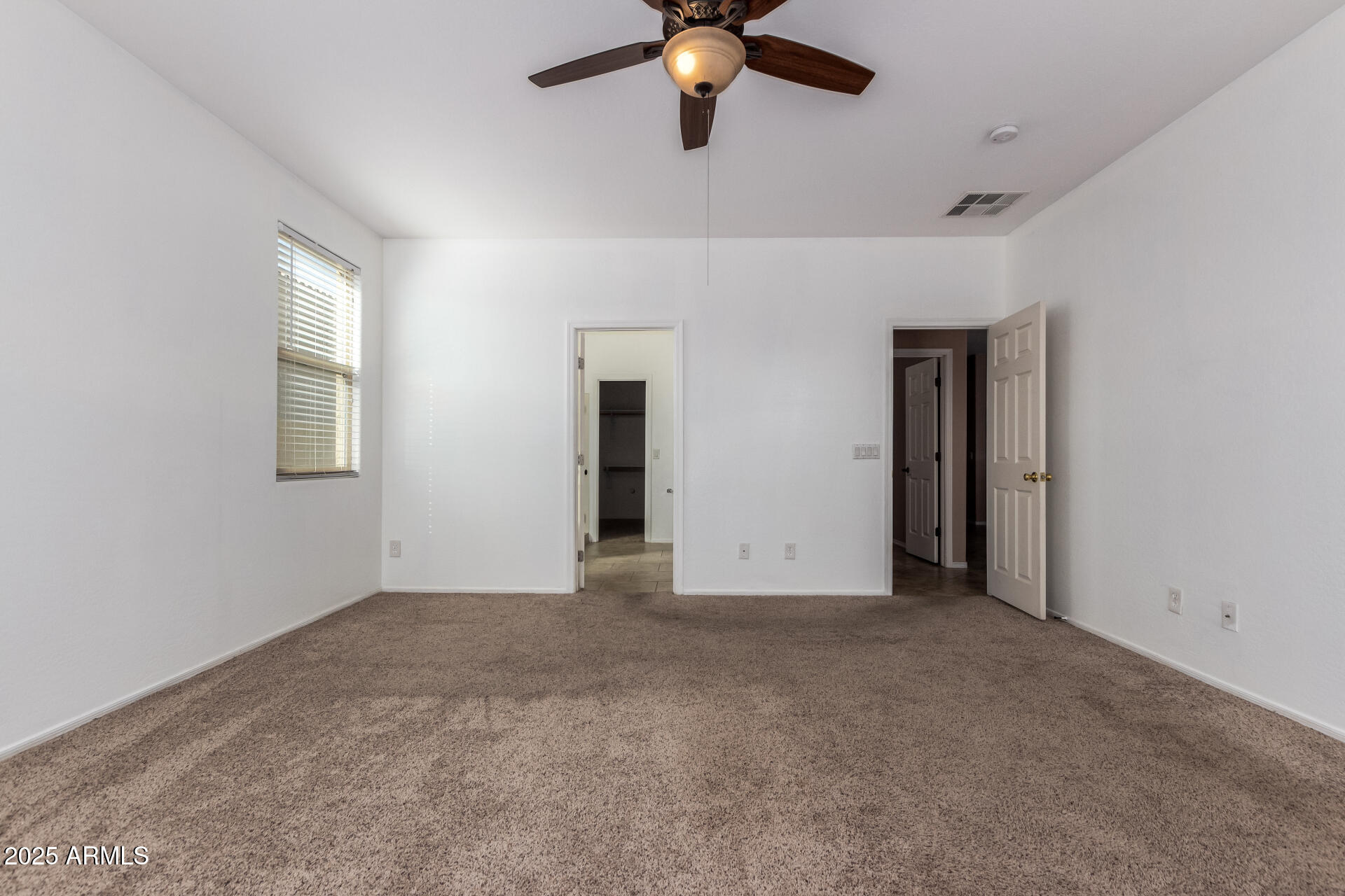 3127 West Apollo Road Phoenix, AZ 85041 - Photo 11 of 28 a view of an empty room with a window