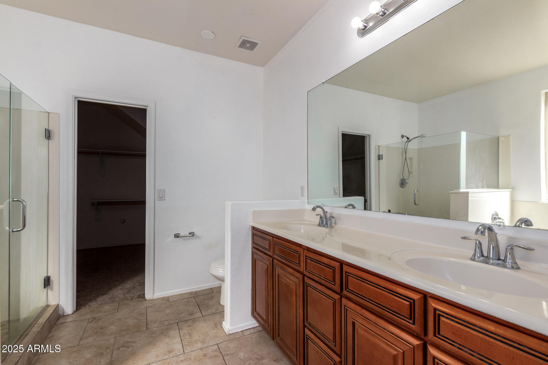 3127 West Apollo Road Phoenix, AZ 85041 - Photo 13 of 28 a bathroom with a sink and a mirror