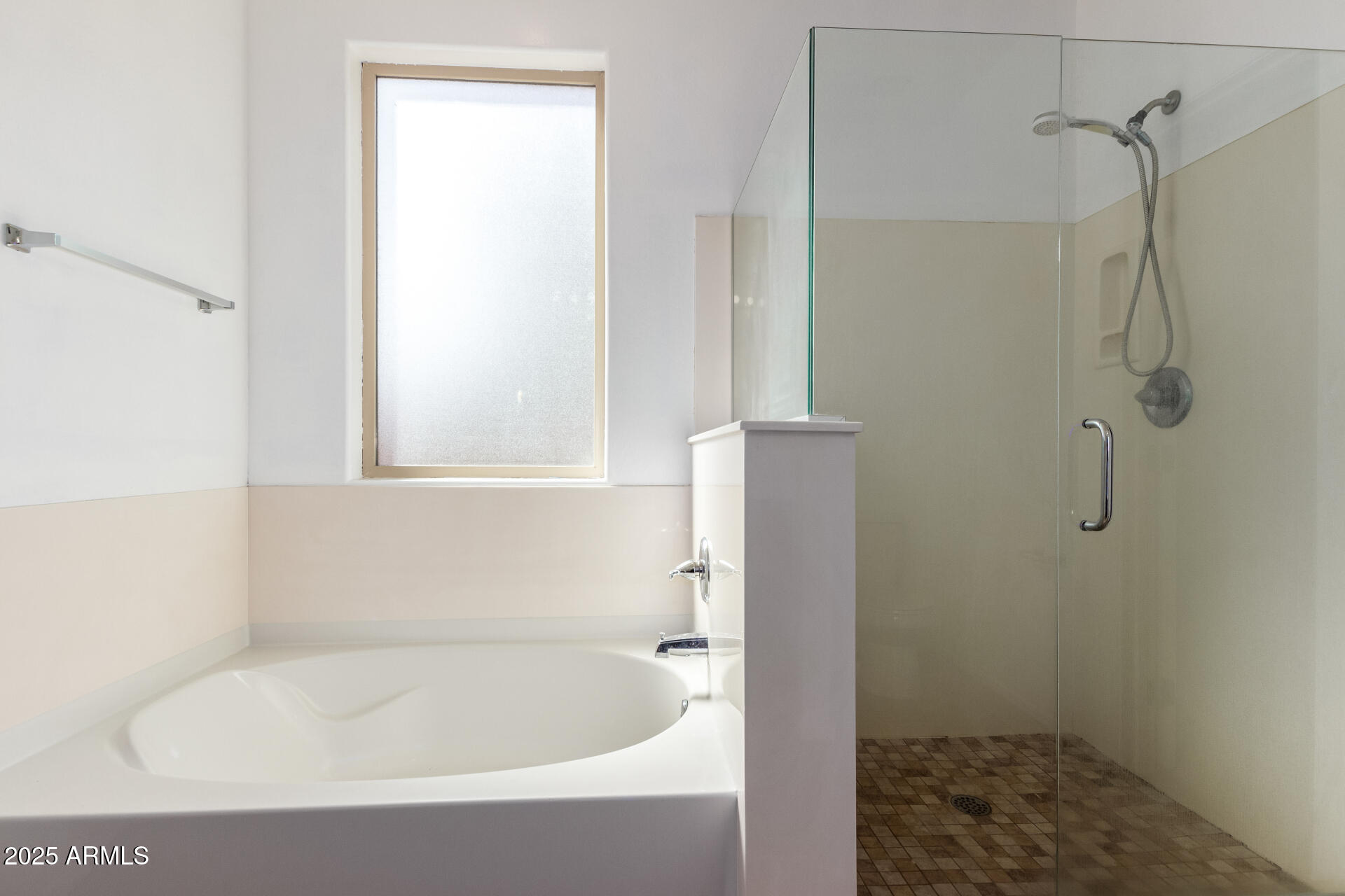 3127 West Apollo Road Phoenix, AZ 85041 - Photo 14 of 28 a white bath tub sitting next to a shower