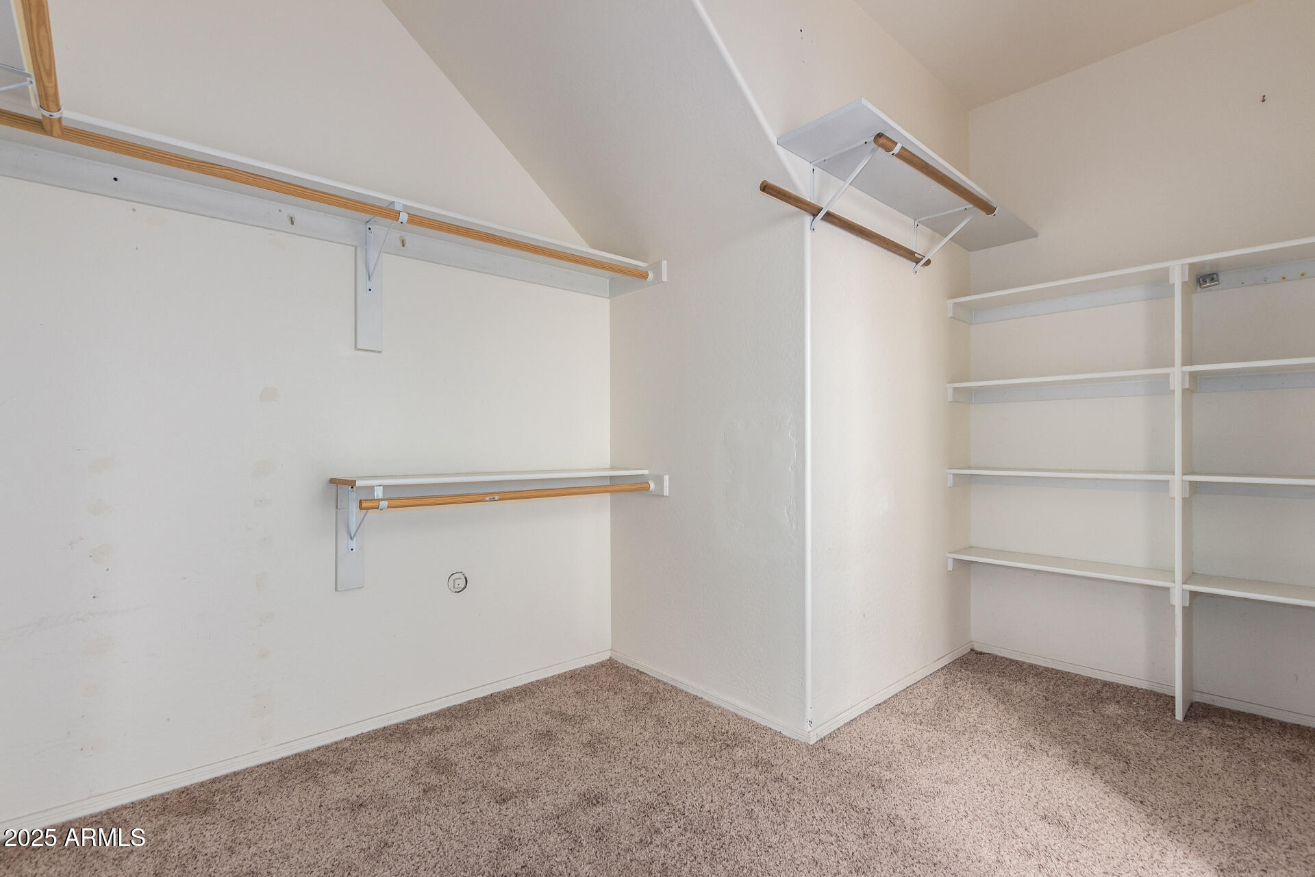 3127 West Apollo Road Phoenix, AZ 85041 - Photo 15 of 28 a view of an empty walk in closet