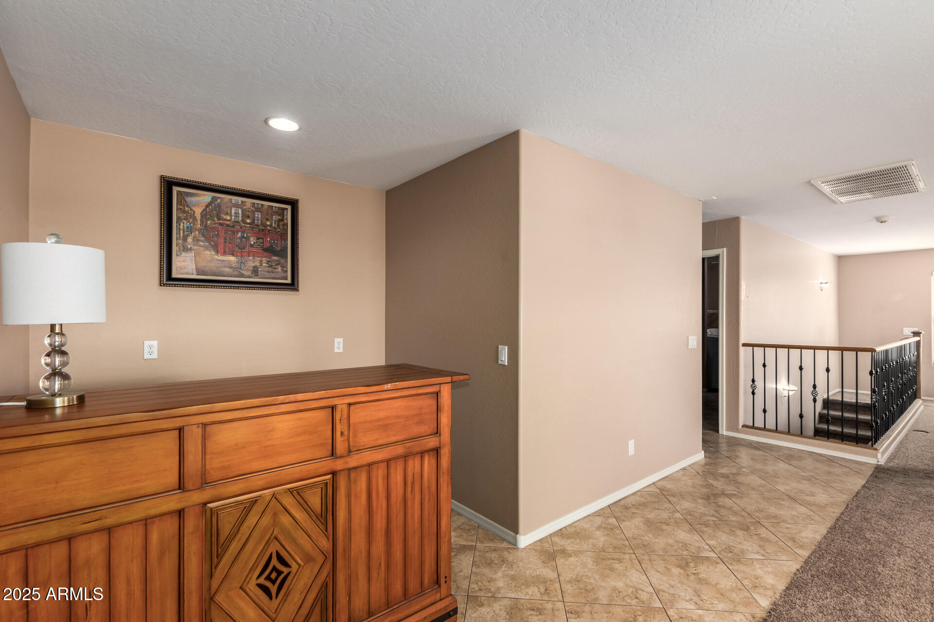 3127 West Apollo Road Phoenix, AZ 85041 - Photo 17 of 28 a view of a hallway to a livingroom with furniture