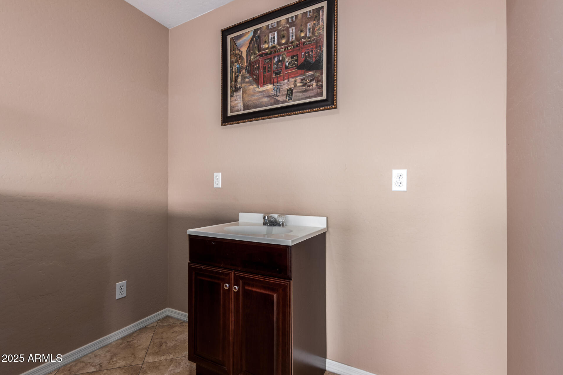 3127 West Apollo Road Phoenix, AZ 85041 - Photo 18 of 28 a bathroom with a sink and a mirror