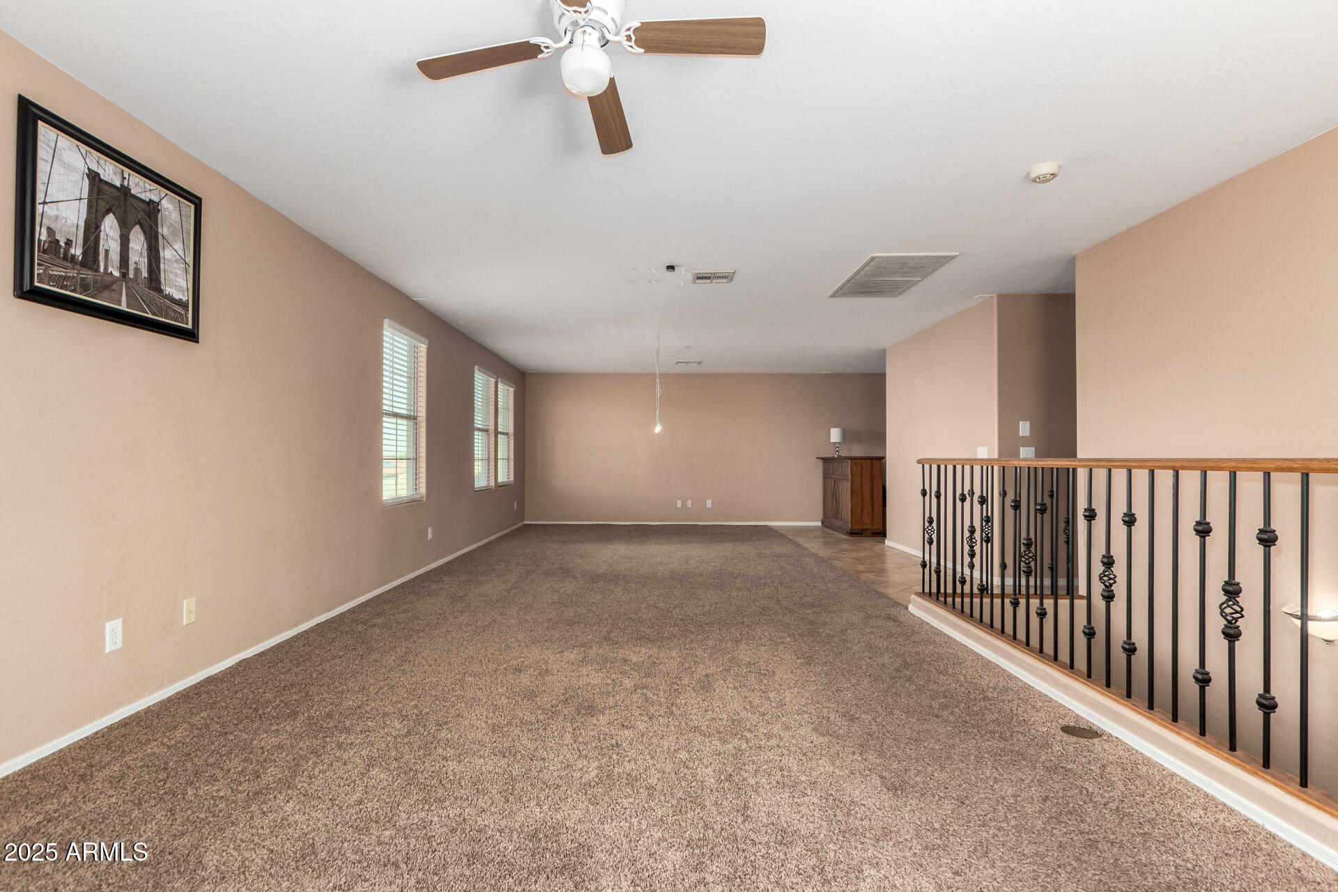 3127 West Apollo Road Phoenix, AZ 85041 - Photo 19 of 28 a view of a livingroom with a ceiling fan and window