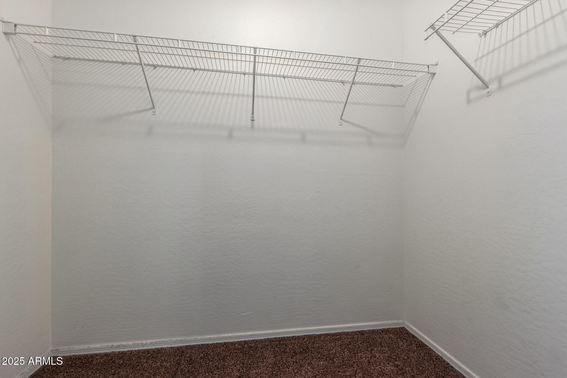 3127 West Apollo Road Phoenix, AZ 85041 - Photo 24 of 28 a view of a room with racks on the wall