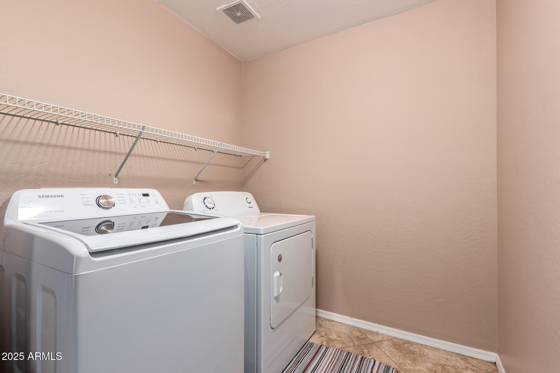 3127 West Apollo Road Phoenix, AZ 85041 - Photo 26 of 28 a utility room with dryer and washer