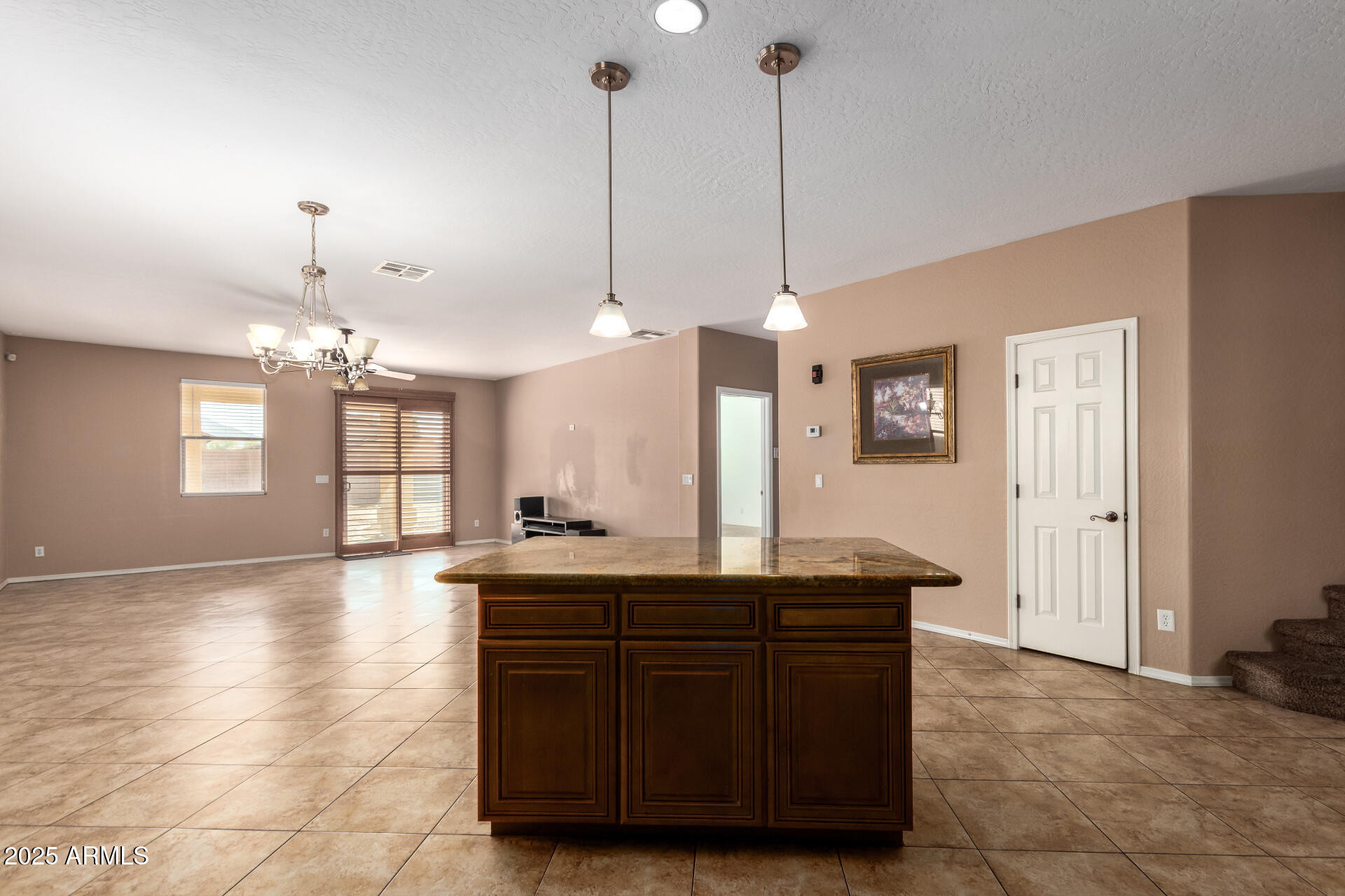 3127 West Apollo Road Phoenix, AZ 85041 - Photo 3 of 28 a view with granite countertop a sink a counter space and a window
