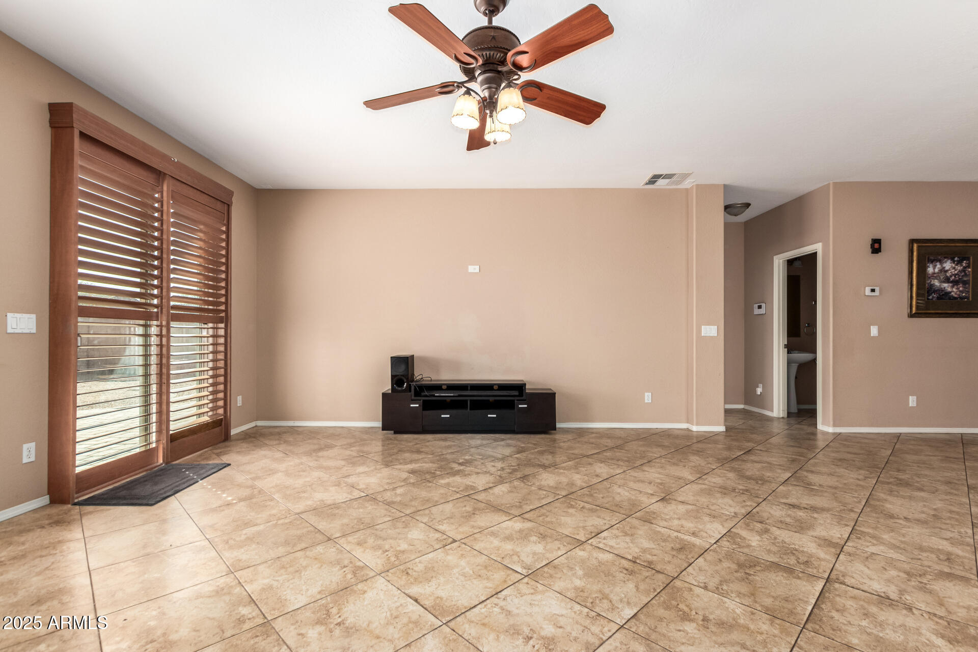 3127 West Apollo Road Phoenix, AZ 85041 - Photo 7 of 28 a view of an empty room with a window
