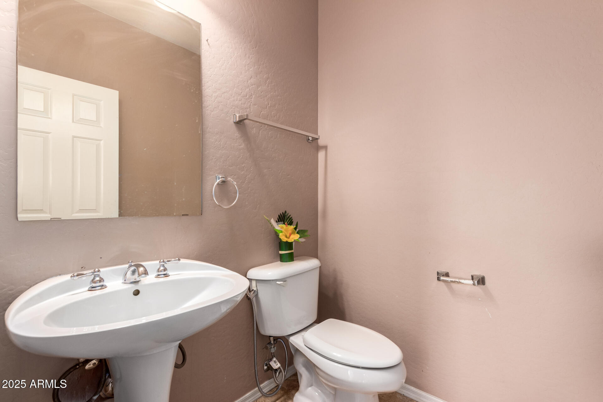 3127 West Apollo Road Phoenix, AZ 85041 - Photo 9 of 28 a bathroom with a sink a toilet and a mirror