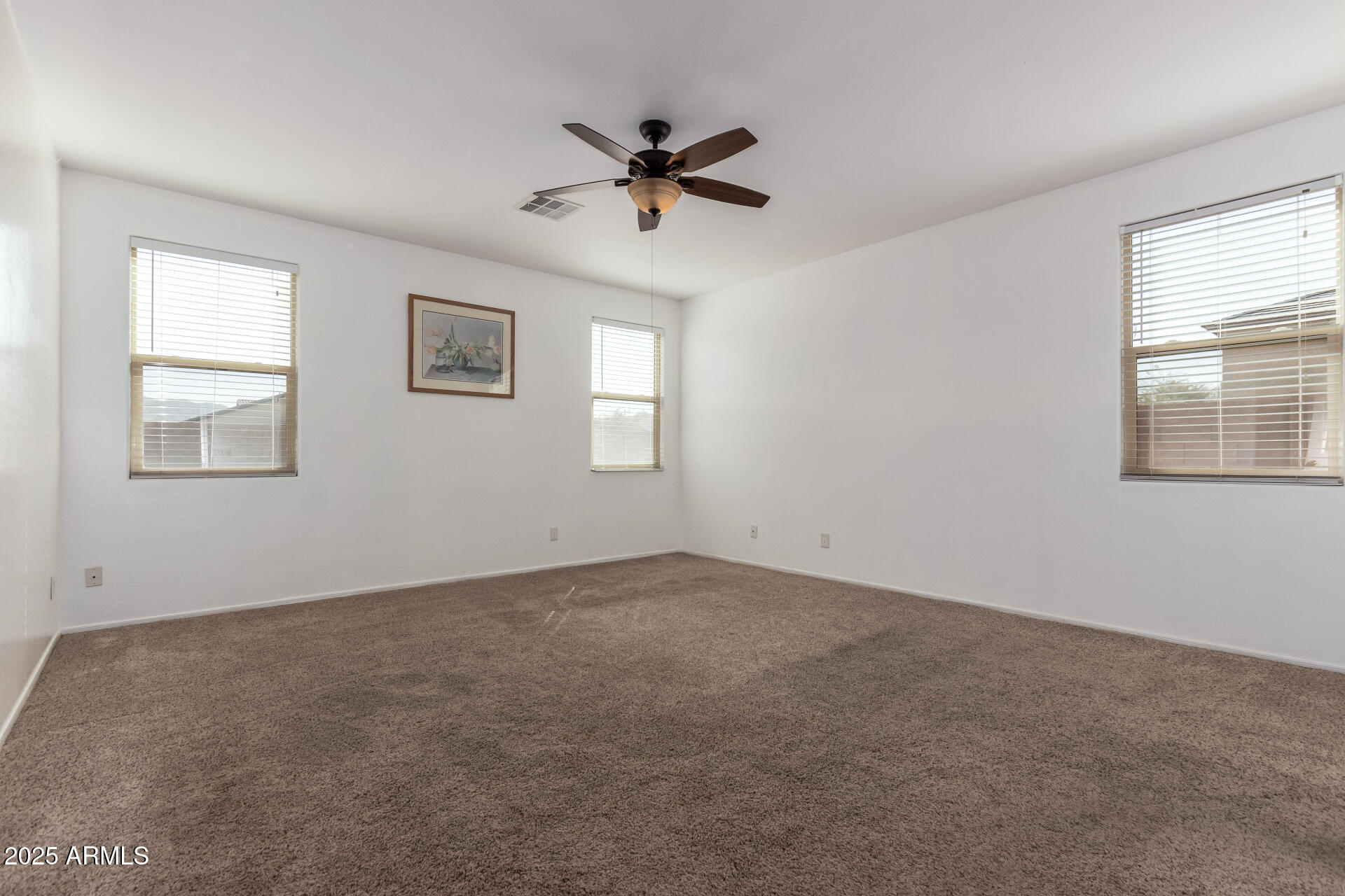 3127 West Apollo Road Phoenix, AZ 85041 - Photo 10 of 28 a view of an empty room with a window