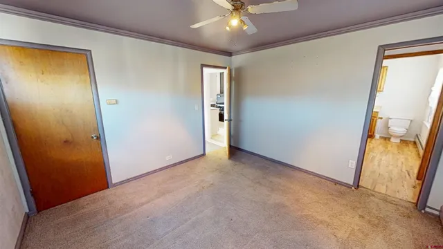 an empty room with windows and entrance