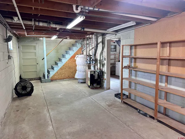 a view of an empty room with gym equipment