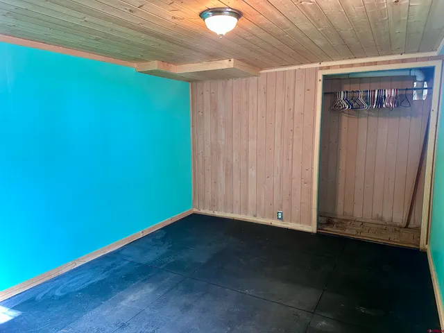 a view of an empty room and wooden floor