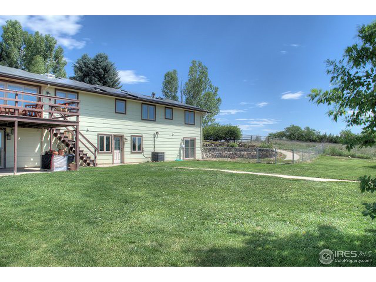 9920 Phillips Road Lafayette, CO 80026 - Photo 14 of 18 a view of a house with a big yard