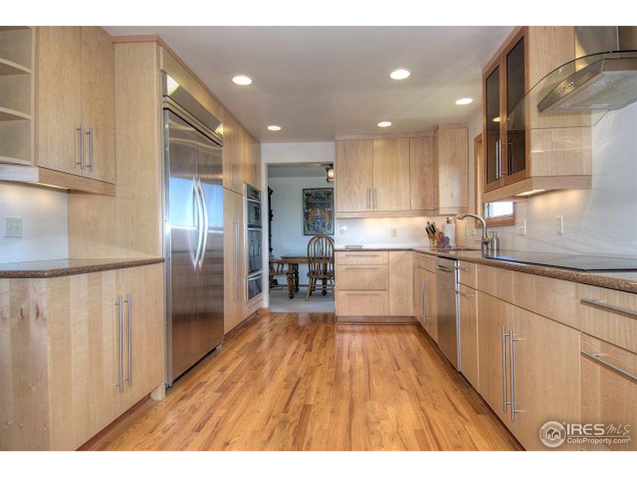 9920 Phillips Road Lafayette, CO 80026 - Photo 2 of 18 a kitchen with stainless steel appliances granite countertop a refrigerator a sink and a stove