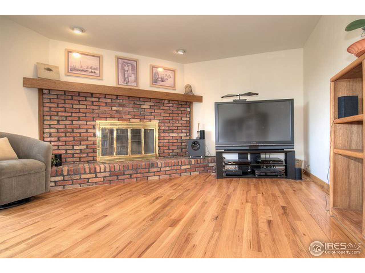 9920 Phillips Road Lafayette, CO 80026 - Photo 4 of 18 a living room with furniture and a flat screen tv