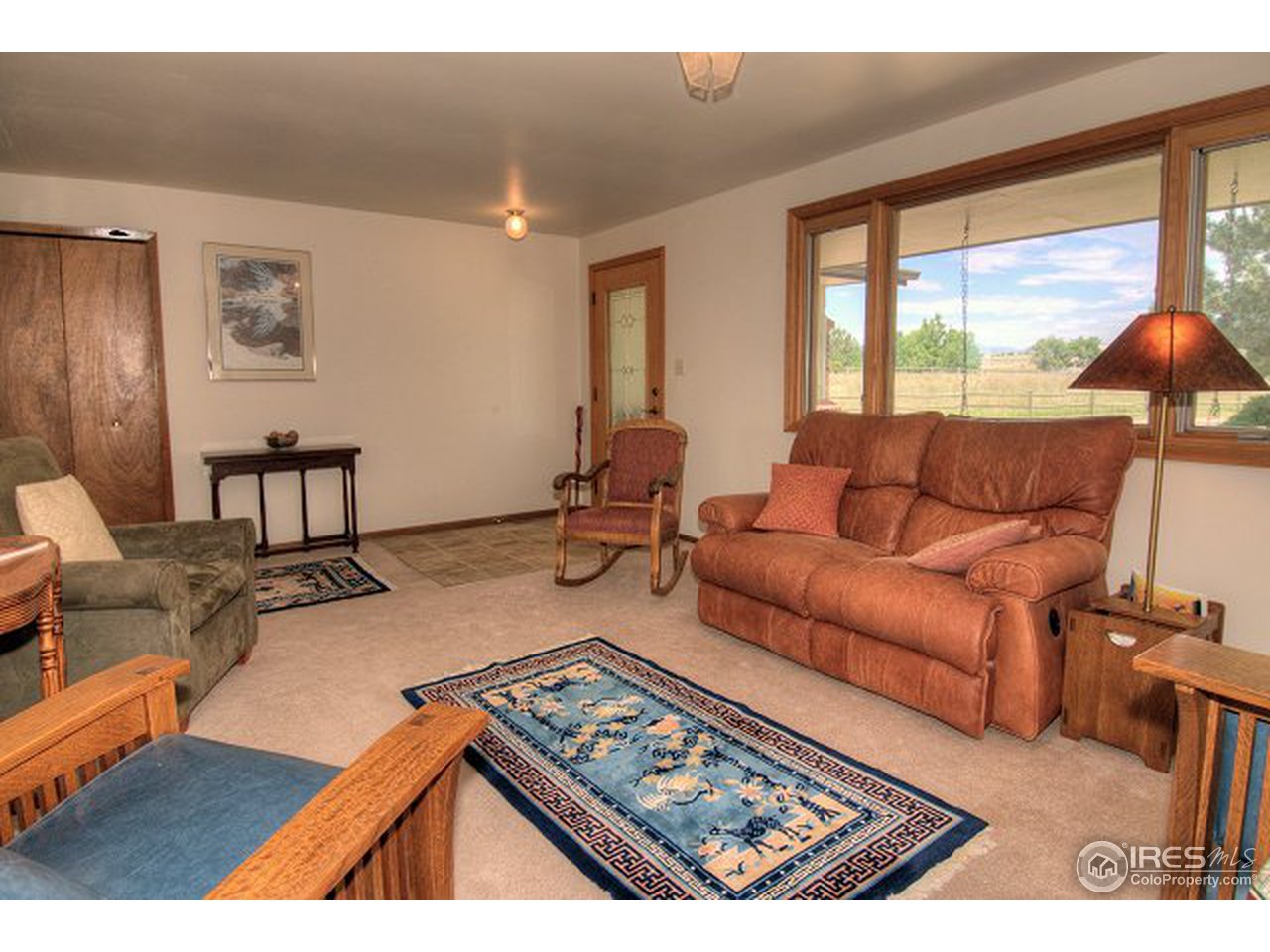 9920 Phillips Road Lafayette, CO 80026 - Photo 7 of 18 a living room with furniture and a large window