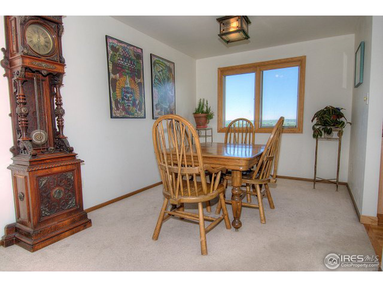 9920 Phillips Road Lafayette, CO 80026 - Photo 9 of 18 a dining room with furniture and a window