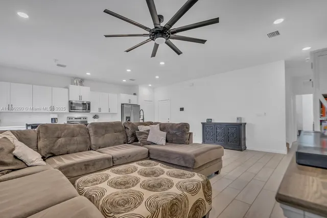 a living room with furniture and a couch