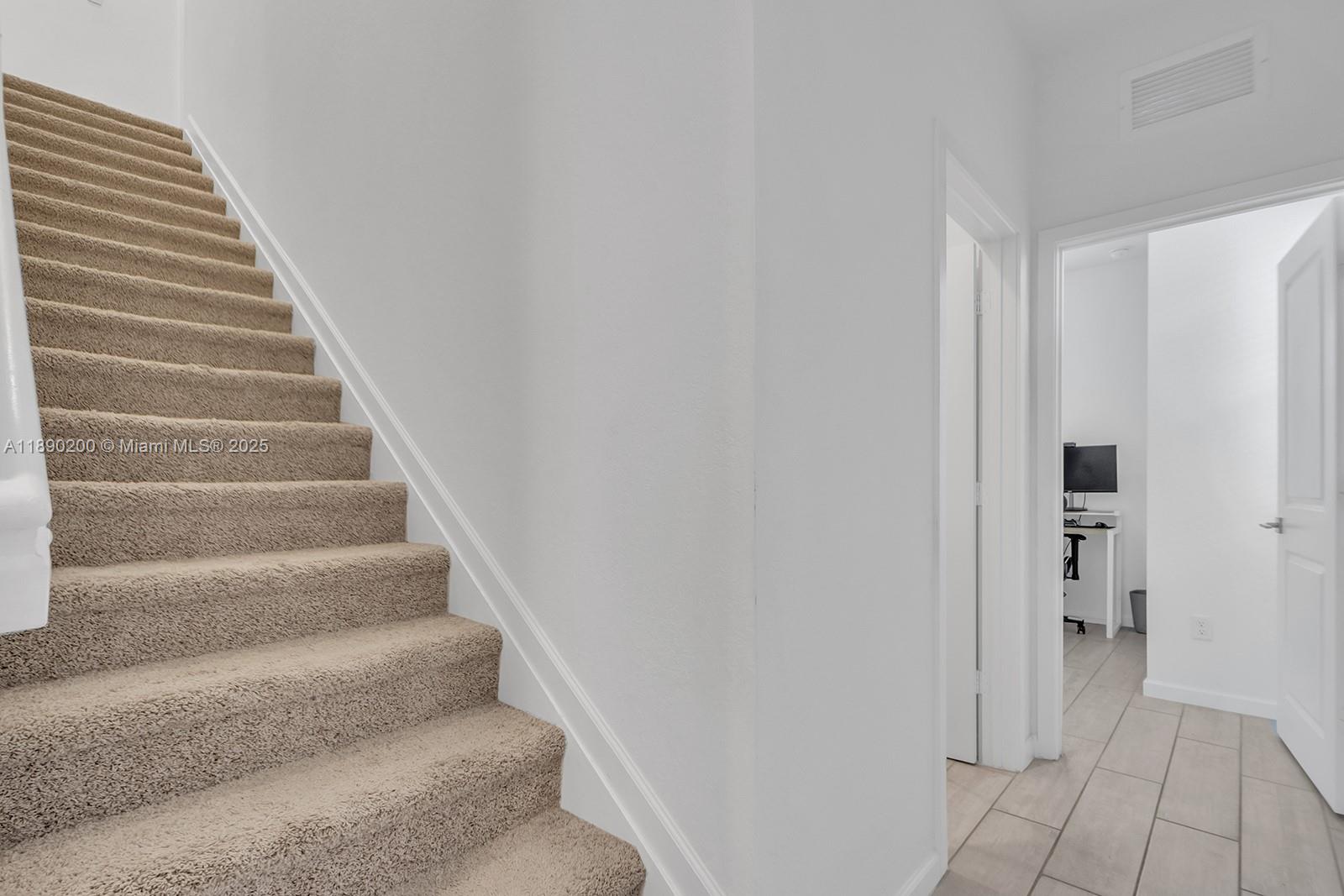 1772 Southeast 8th Street Homestead, FL 33033 - Photo 12 of 42 a view of an entryway with staircase