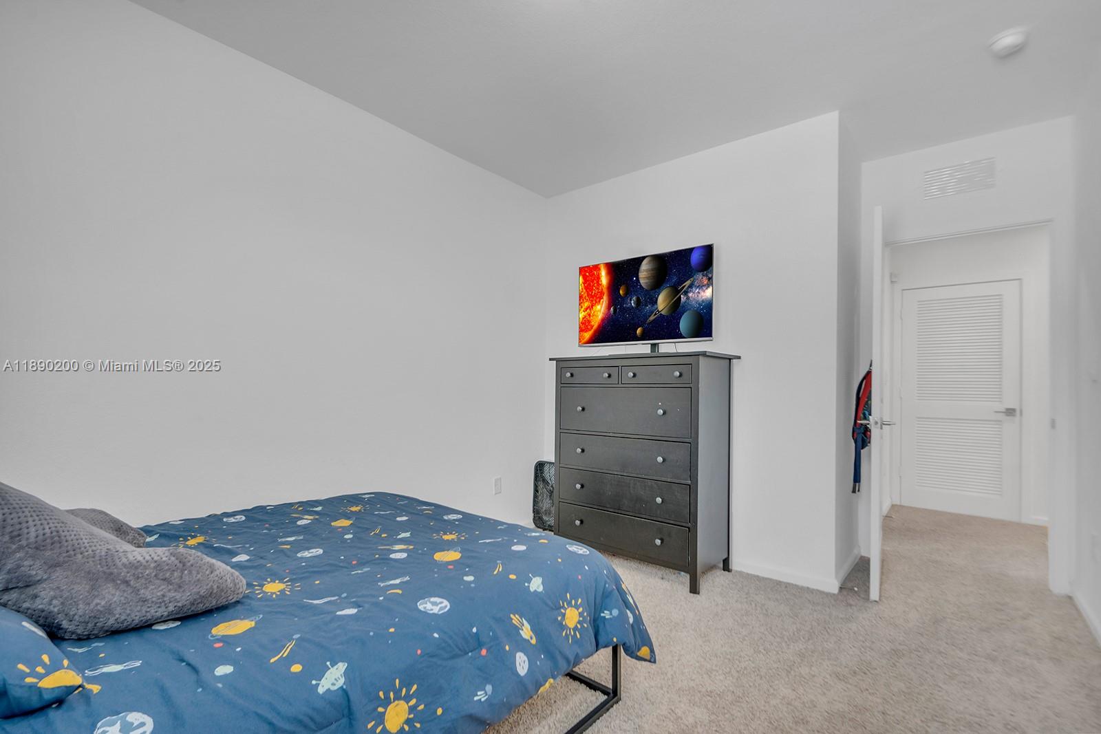 1772 Southeast 8th Street Homestead, FL 33033 - Photo 23 of 42 a bedroom with a bed and a television