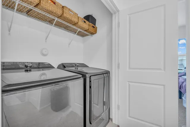a utility room with dryer and washer