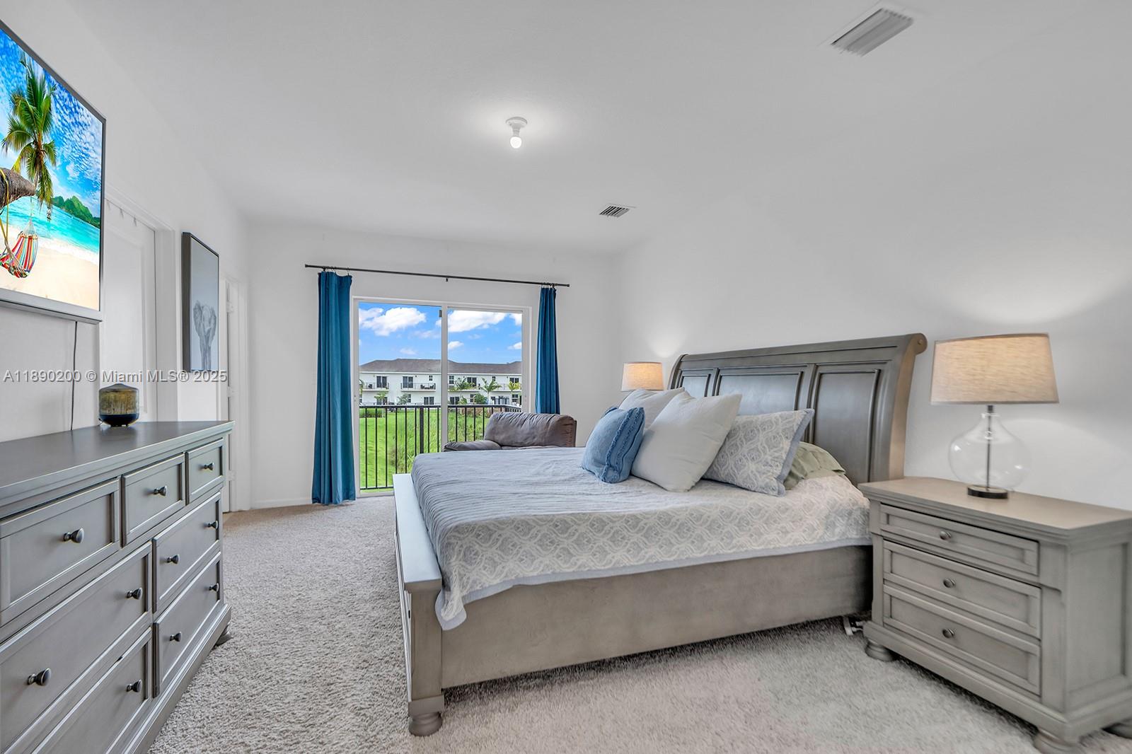 1772 Southeast 8th Street Homestead, FL 33033 - Photo 25 of 42 a bedroom with a large bed and a window