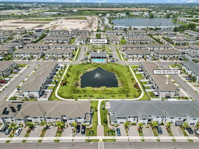 an aerial view of residential building and parking space