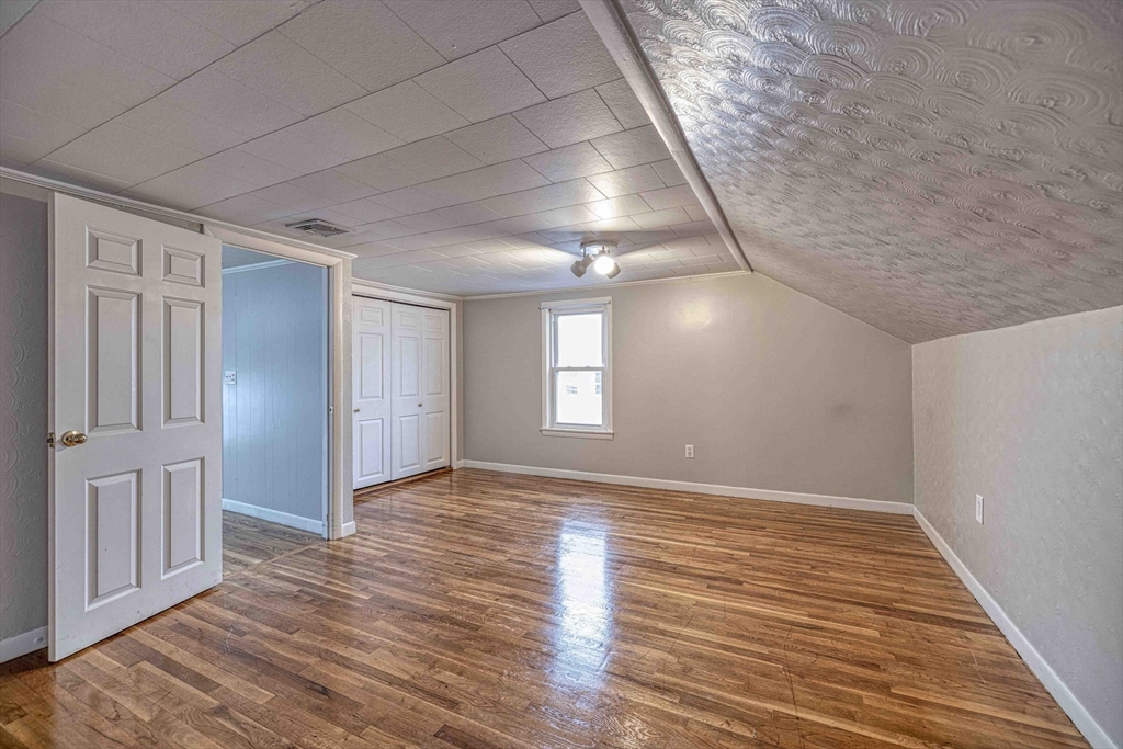 1636 South Main Street, Unit 3 Fall River, MA 02724 - Photo 8 of 14 a view of an empty room with wooden floor