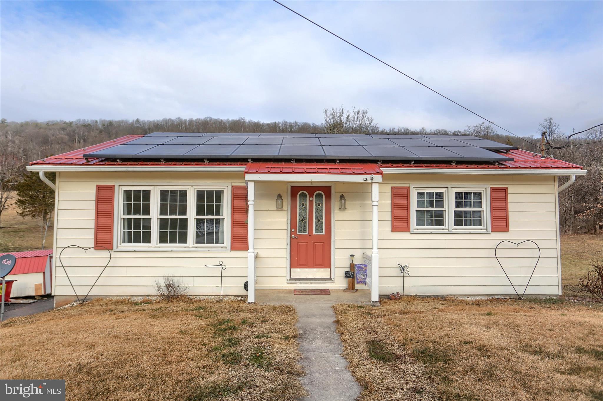 front view of a house with a dry chair