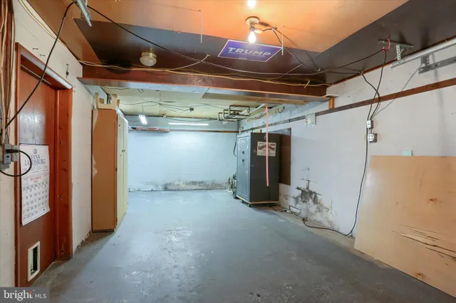 a view of empty room with wooden walls