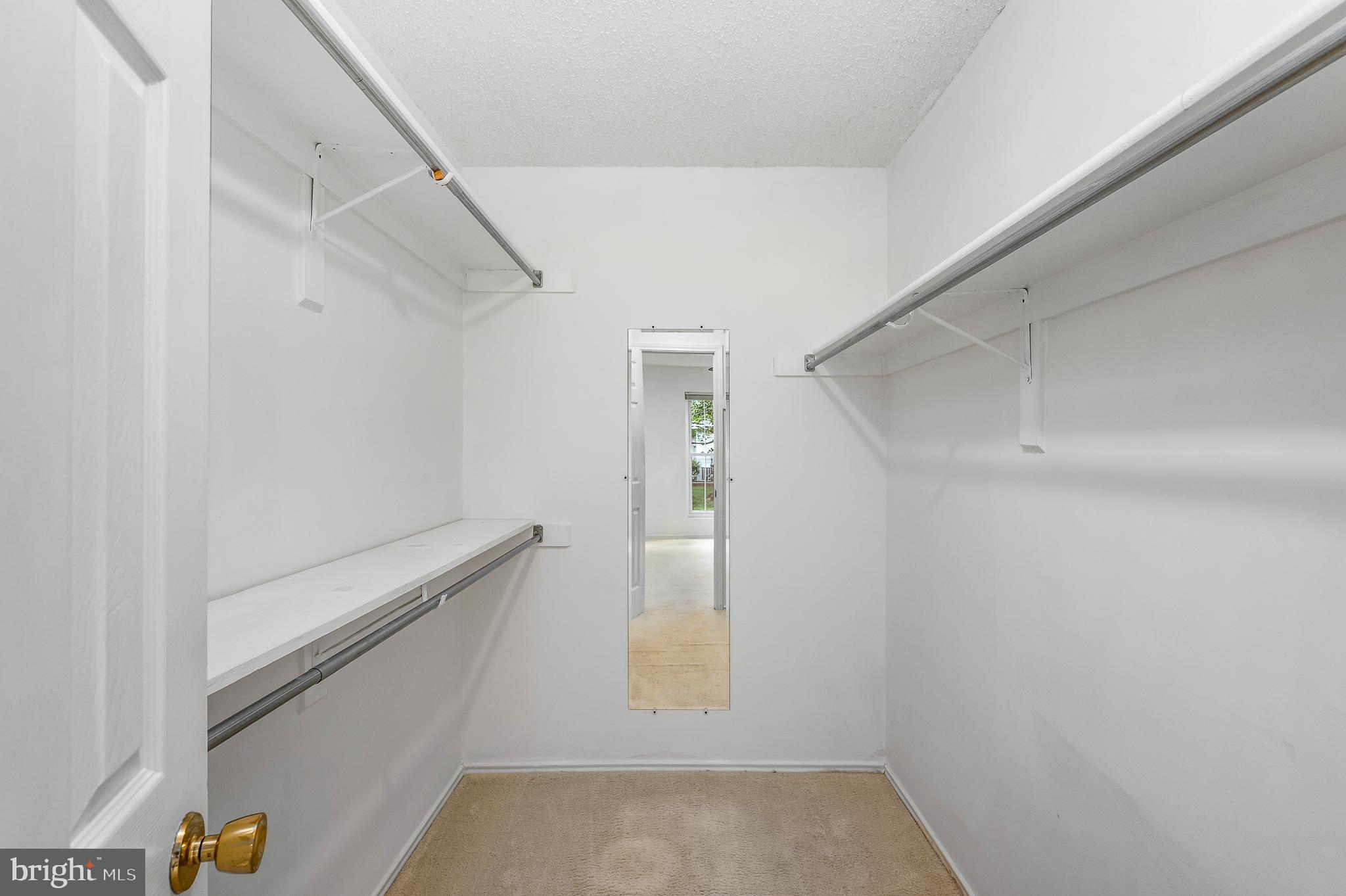 21029 Timber Ridge Terrace, Unit 104 Ashburn, VA 20147 - Photo 21 of 34 Walk in closet in Owner's Bedroom